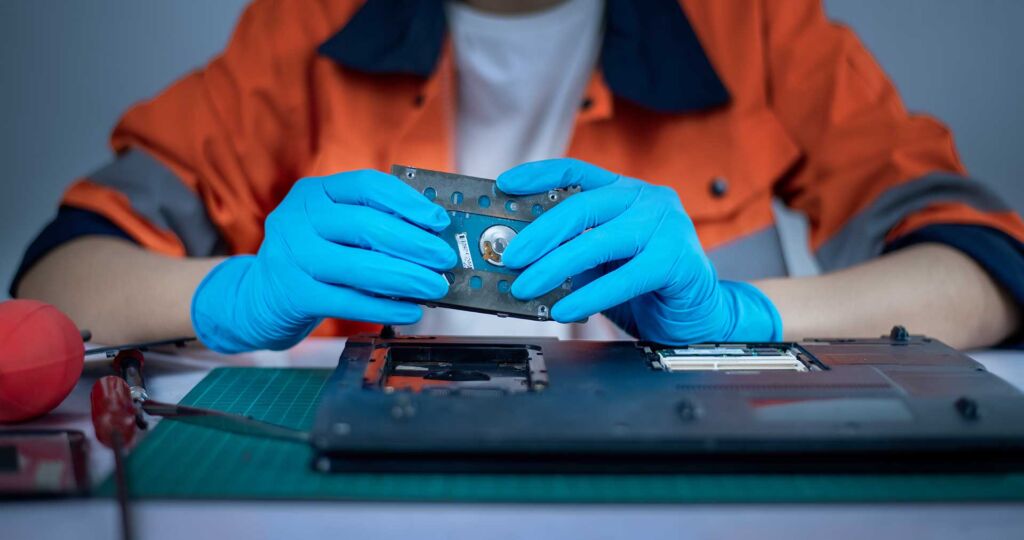 Technician creating a forensic image of a hard drive at a digital forensics lab in Mississauga