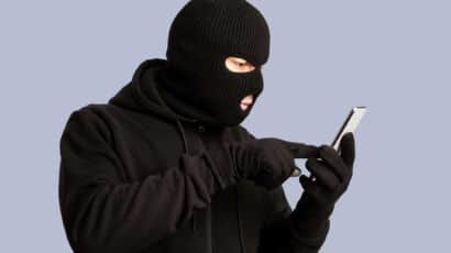 Certified examiner checking a smartphone for signs your phone is hacked at a Mississauga forensics lab