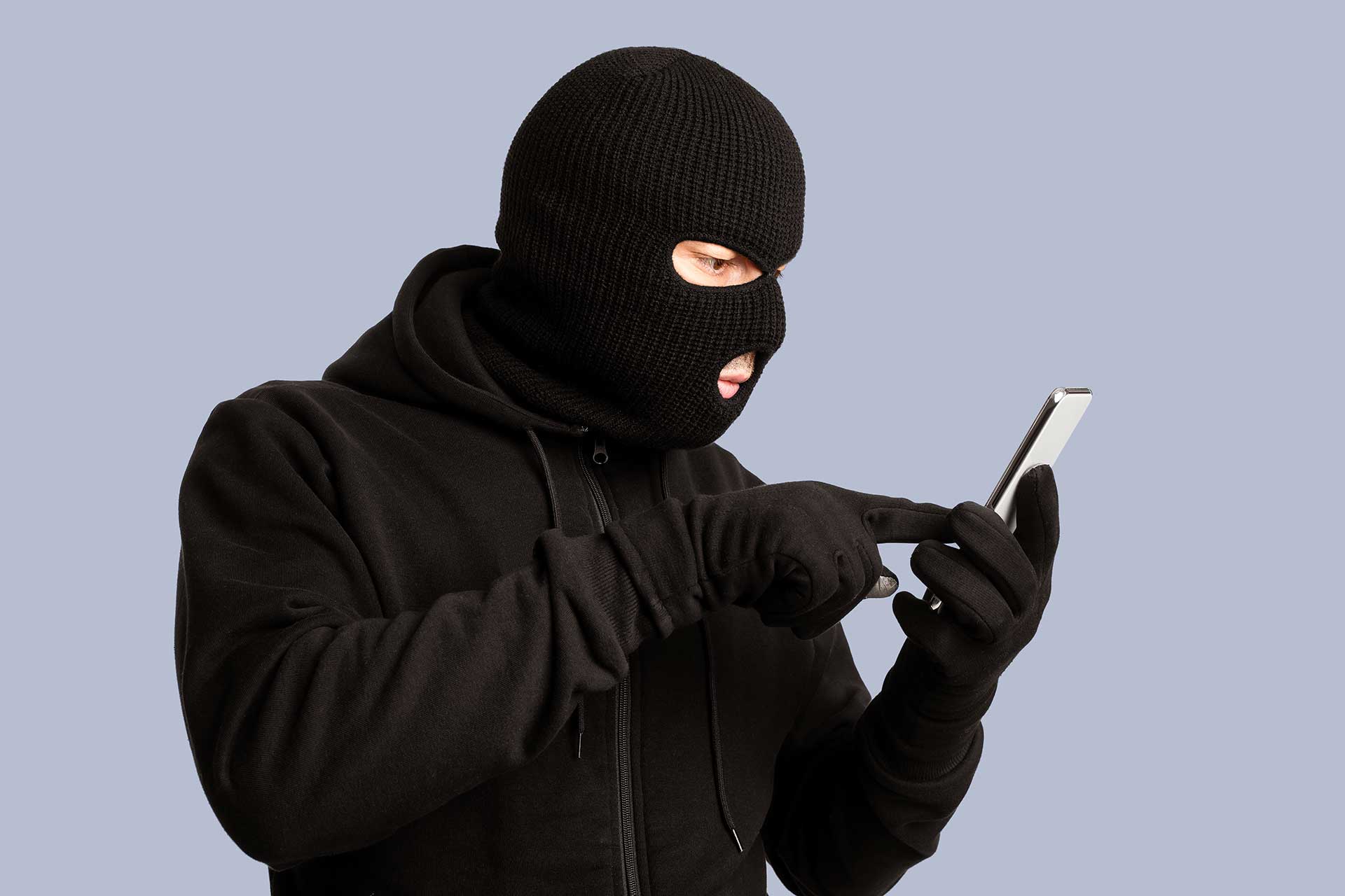 Certified examiner checking a smartphone for signs your phone is hacked at a Mississauga forensics lab