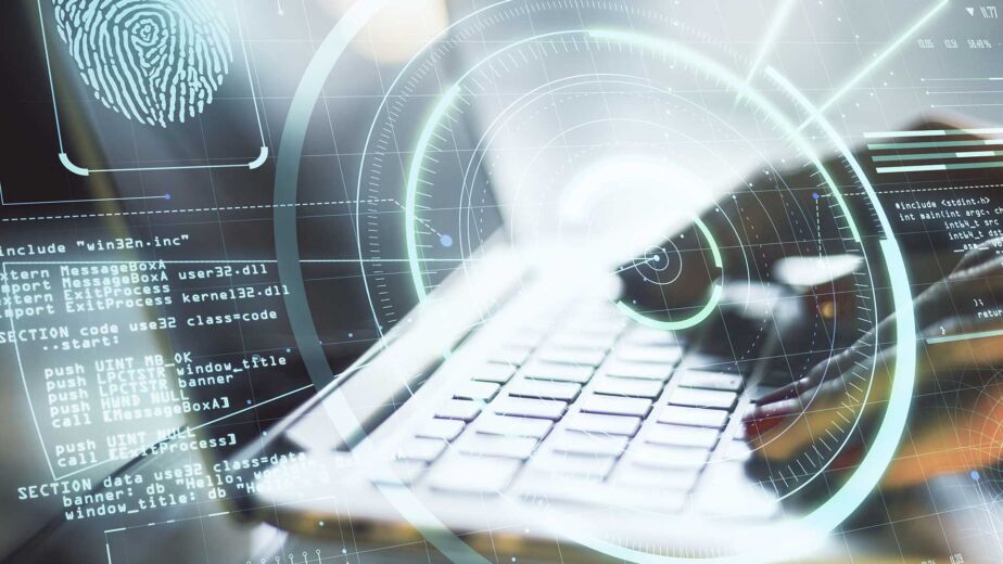 Forensic examiner imaging a laptop after a cyber attack, showing digital forensics vs cybersecurity in practice